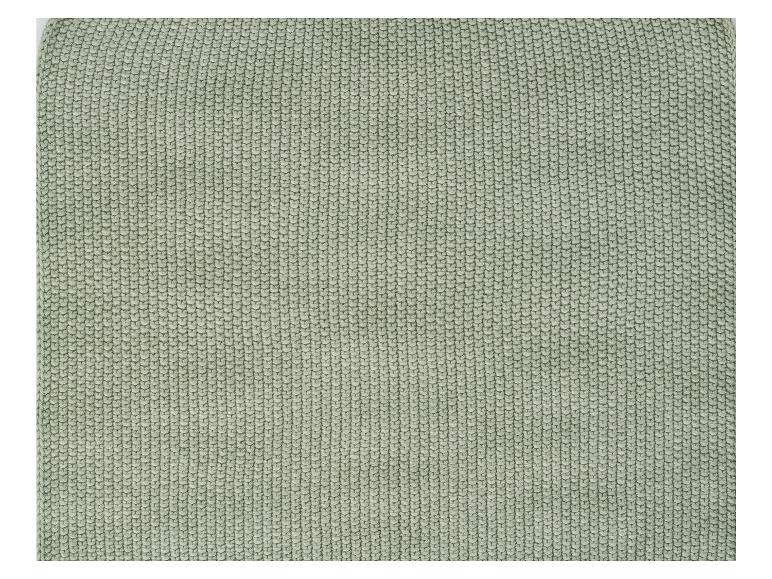 Nahtloser, grüner Strickstoff.