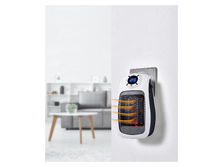 Tragbarer Steckdosenheizer mit Digitalanzeige in einem modernen Zuhause