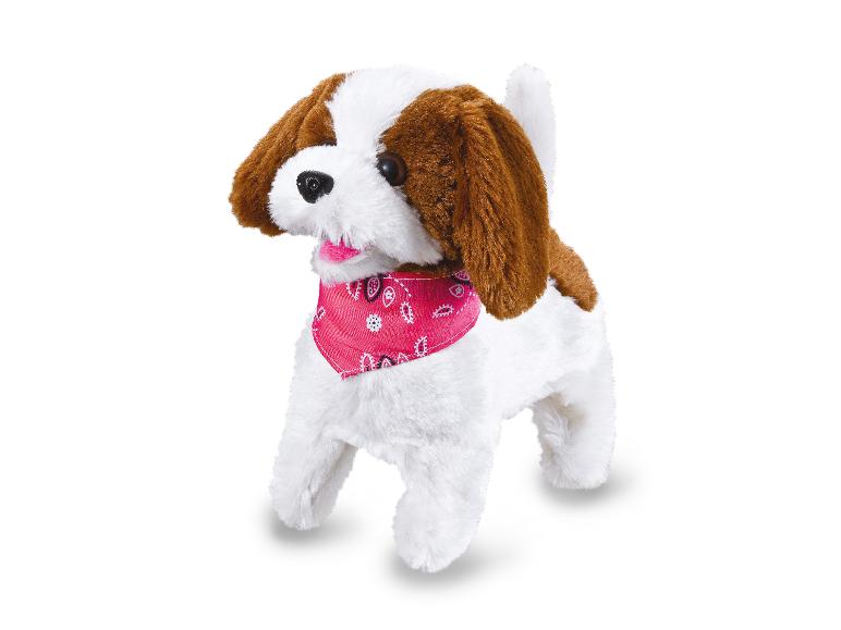 Ein brauner und weißer Plüschhund mit einem rosa Halstuch.