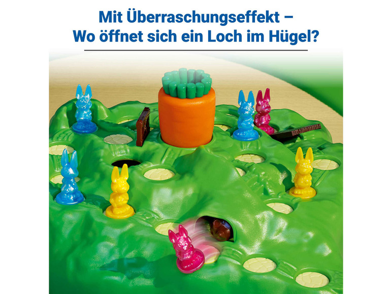 Ein Brettspiel mit Hasen, einer Karotte und einem Loch im Hügel