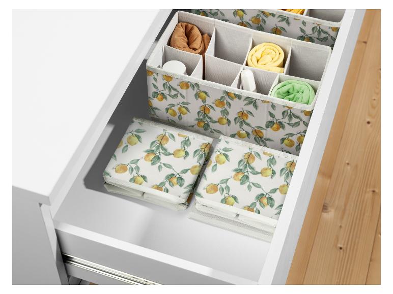 Schubladenorganizer mit Zitronenmuster, Trennern und faltbaren Boxen.
