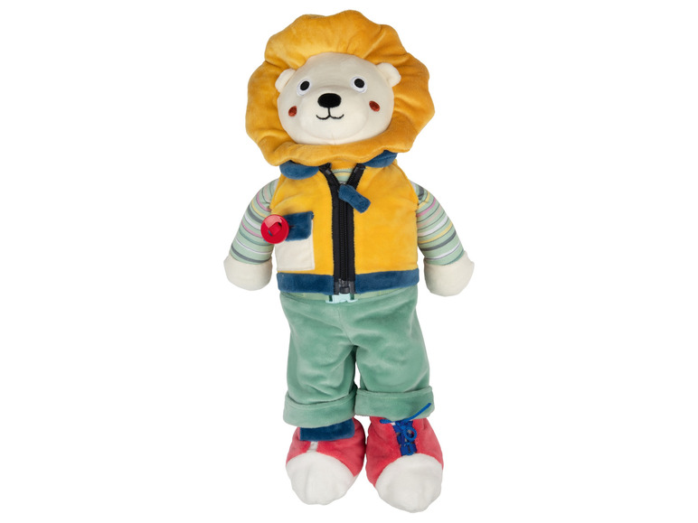 Ein Plüschlöwe mit einer gelben Weste und grünen Hosen.
