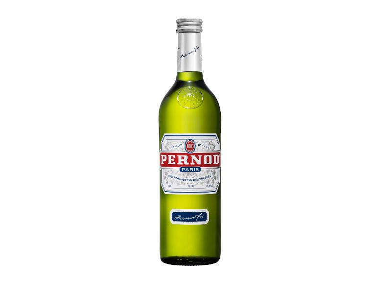 Grüne Flasche Anislikör mit einem weißen und roten Etikett.