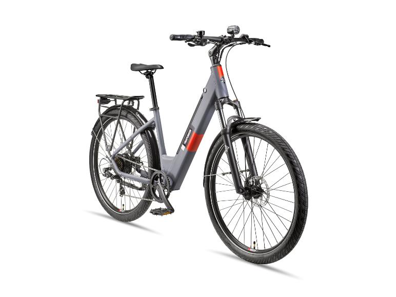 Graues E-Bike mit Gepäckträger und Beleuchtung, schräge Vorderansicht.