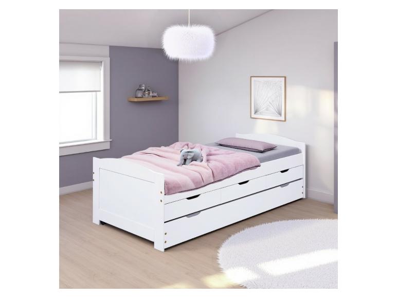 Ein weißes Bett mit Stauraum und einem flauschigen Teppich