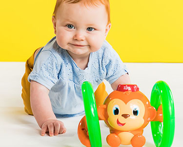 Bright Starts Roll & Glow Monkey™ Toy, bewegungsmotivierend 