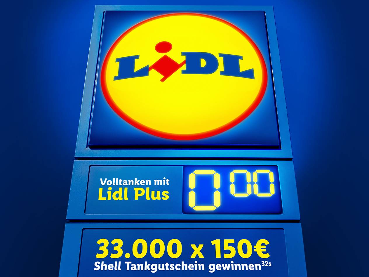 Leuchtendes Schild mit dem Logo eines Discounters, darunter eine digitale Anzeige und ein Gewinnspiel.