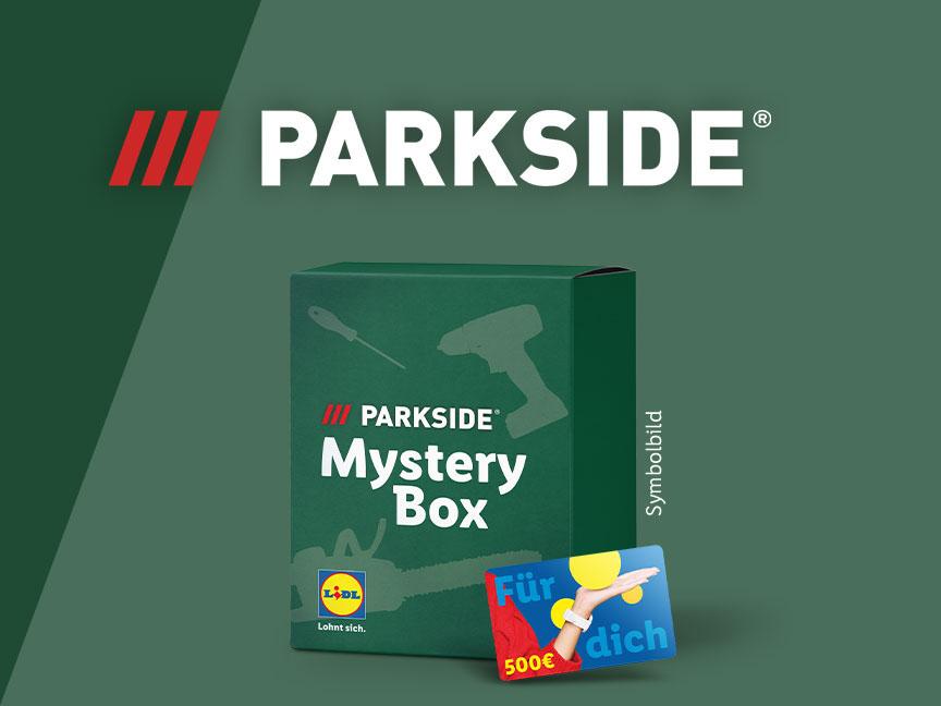 Grüne Mystery Box mit Werkzeug-Symbolen und einer Geschenkkarte über 500€.